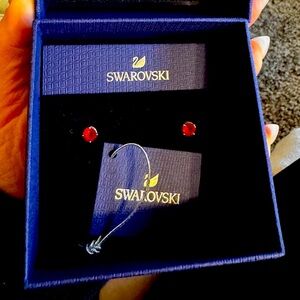 Swarovski red stud earrings. BNIB